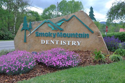 Smoky Mountain Dentistry Logo and Signage on a Rock 