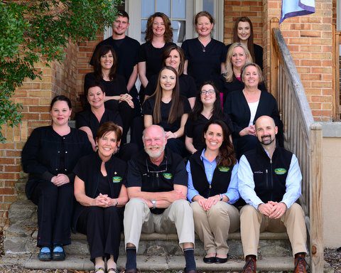 The Staff of Smoky Mountain Dentistry Sitting on Stairs
